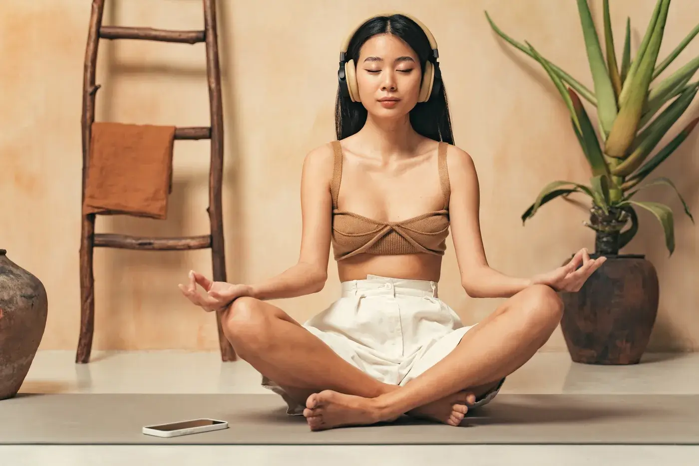 asian-woman-in-headphones-meditatingg